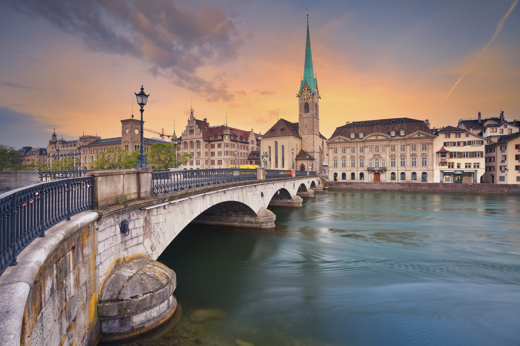 Colorful sunset behind the Zurich cityscape