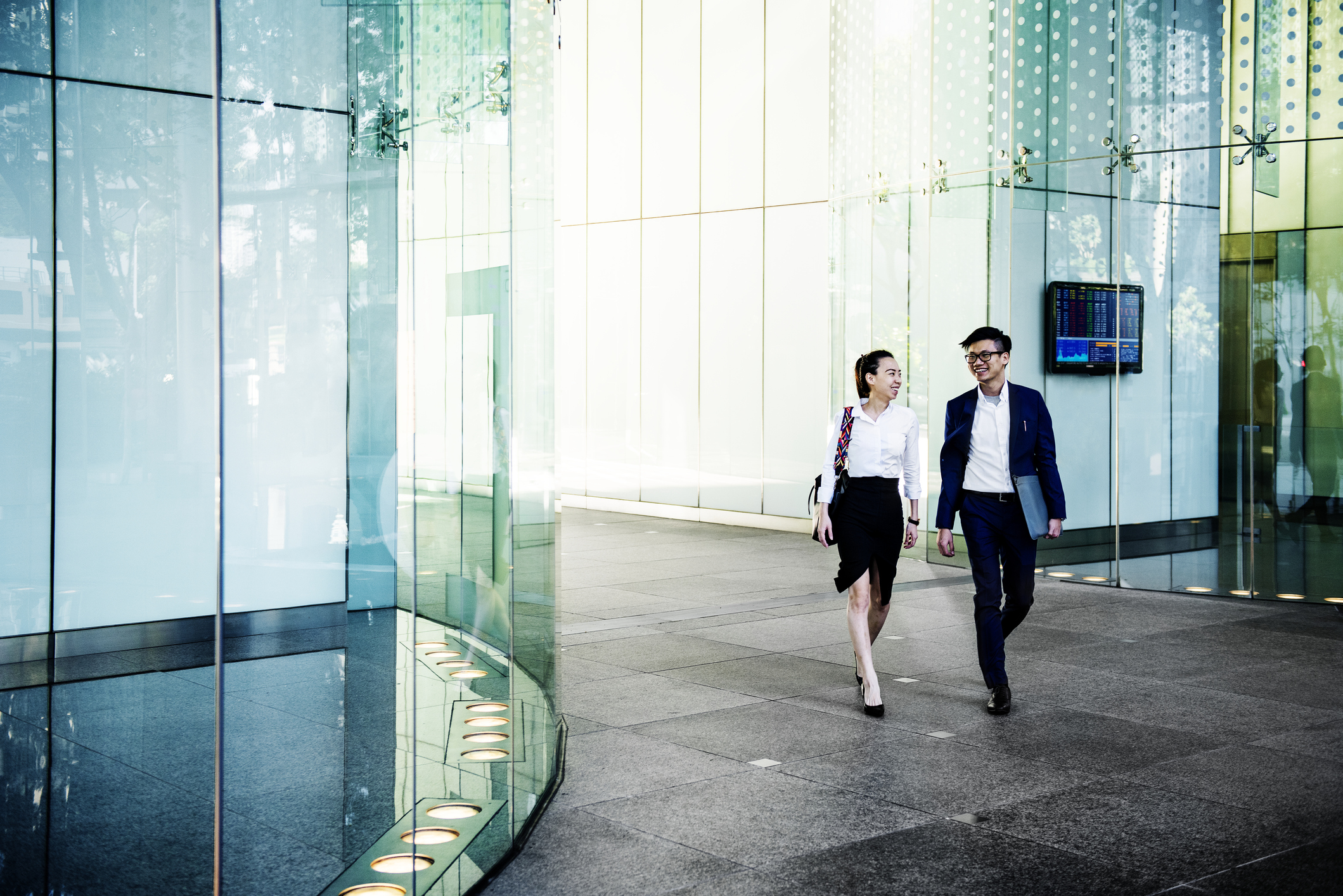 Business people discussing while walking together