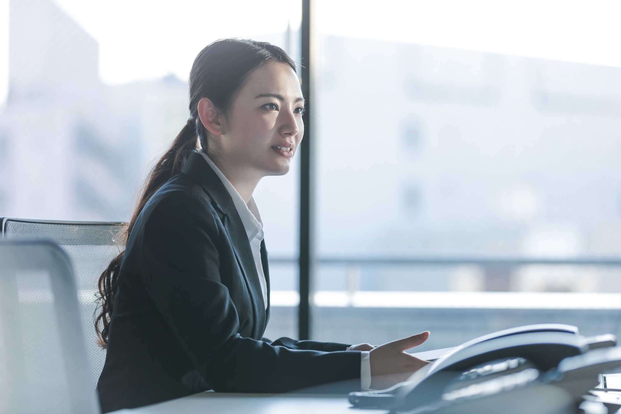 Businesswoman working in the office. Positive workplace concept.